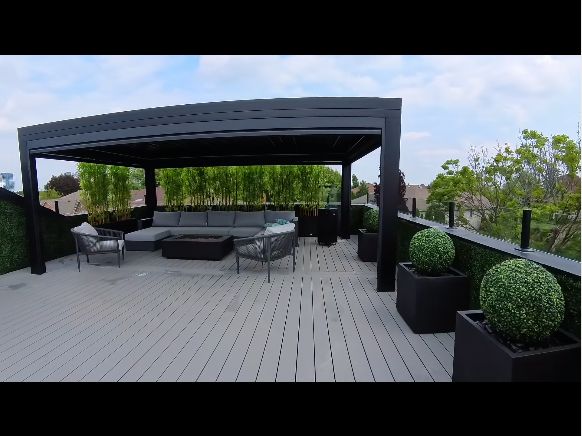 Finished rooftop deck with pergola, seating and planters